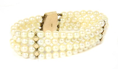 Lot 73 - A gold four row uniform cultured pearl bracelet