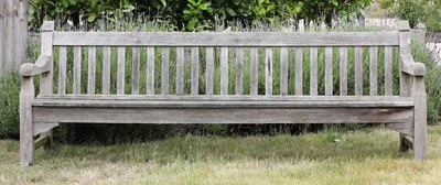 Lot 294 - A large weathered teak garden seat