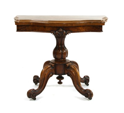 Lot 873 - A Victorian walnut fold over top card table