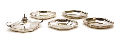 Lot 90 - An Edwardian silver hexagonal table lighter and matching set of four ashtrays