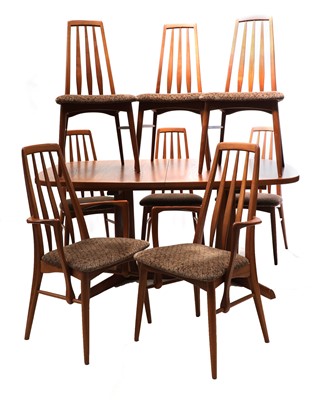 Lot 230 - A teak dining suite