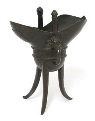 Lot 209 - A Chinese bronze 'jue' cup