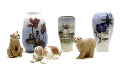 Lot 394 - Four Royal Copehagen fajance year mugs, / Three Royal Copenhagen vases