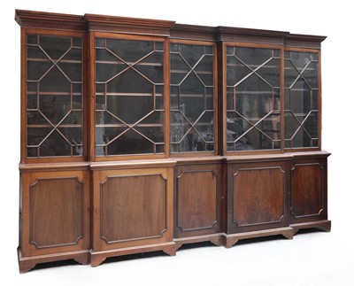 Lot 597 - A large mahogany breakfront library bookcase