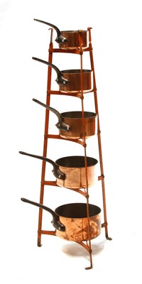 Lot 141 - A graduated set of five copper pans