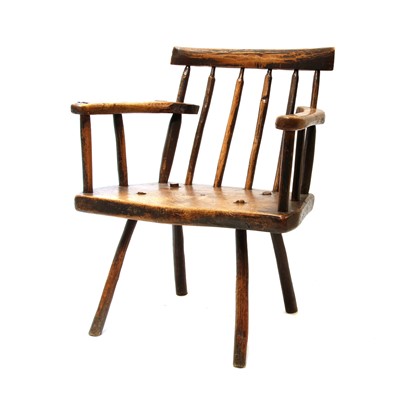 Lot 91 - A primitive fruitwood stick back armchair