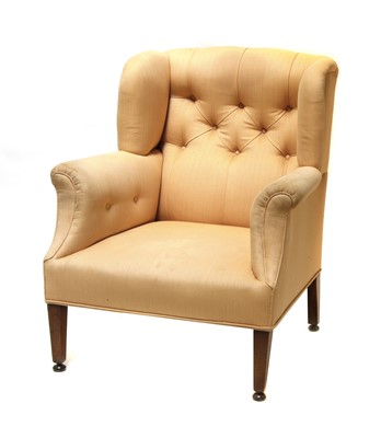 Lot 202 - An Howard-style wingback armchair