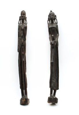 Lot 266 - A pair of African carved ebony figures of water carriers