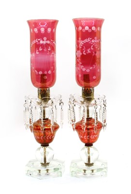 Lot 343 - A pair of Victorian style clear and cranberry glass lustre table lamps