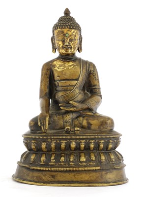 Lot 213 - A Tibetan bronze Shakyamuni Buddha