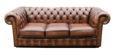 Lot 858 - A brown leather three seater Chesterfield