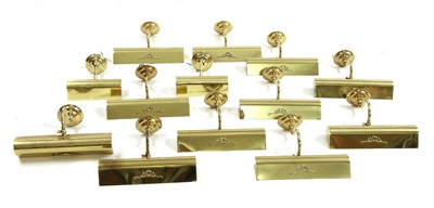 Lot 290 - A set of eleven brass picture lights
