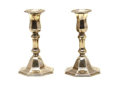 Lot 257 - A pair of silver dwarf candlesticks