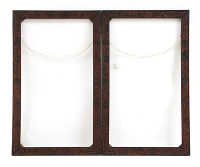Lot 723 - A pair of Chinese carved hardwood rectangular frames