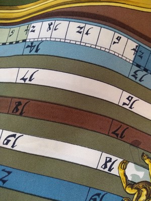 Lot 134 - An Hermès 'Dies et Hore' silk scarf
