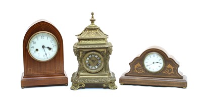 Lot 460 - A Continental brass mantel clock
