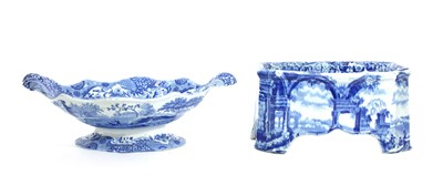 Lot 261 - A blue and white pottery dog bowl