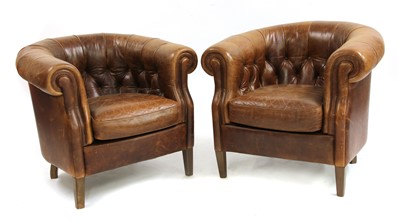 Lot 793 - A pair of brown leather Chesterfield style arm/tub chairs