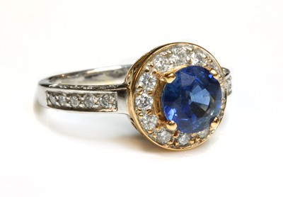 Lot 276 - An 18ct rose and white gold sapphire and diamond halo cluster ring