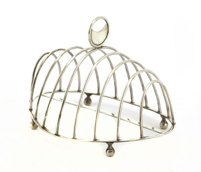 Lot 16 - A George III silver oval eight-division toast rack