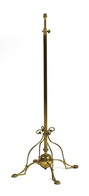 Lot 204 - An Arts and Crafts brass standard lamp
