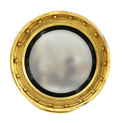 Lot 955 - A Regency circular gilded convex mirror