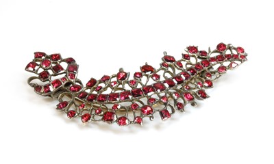 Lot 12 - A foil-backed flat cut garnet brooch