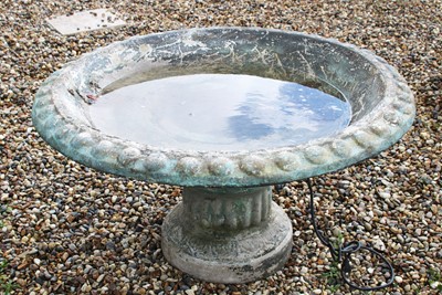 Lot 1031 - A reconstituted stone classical style bird bath