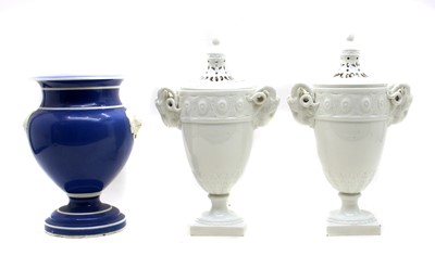 Lot 395 - A pair of French white glazed vases and covers