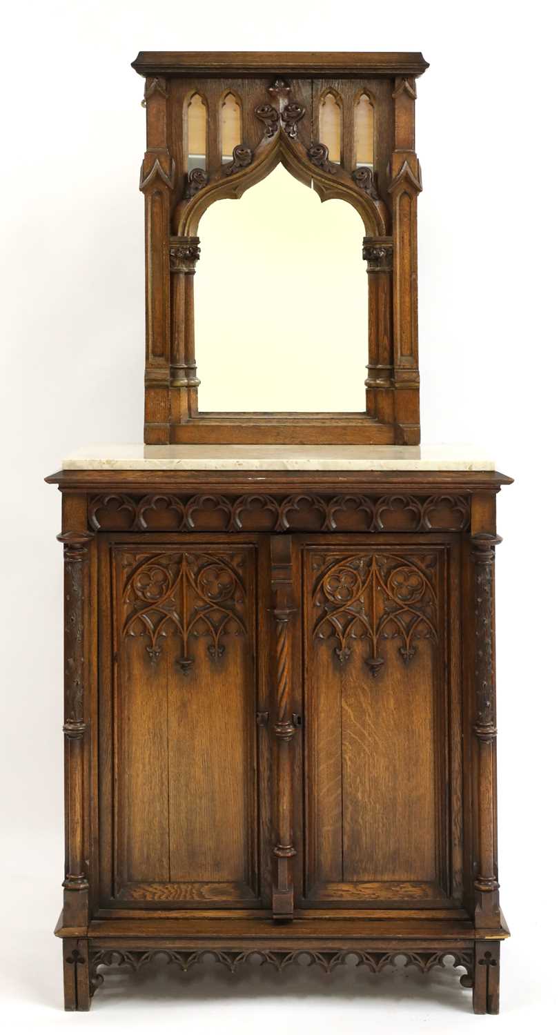 Lot 42 - A German carved oak side cabinet