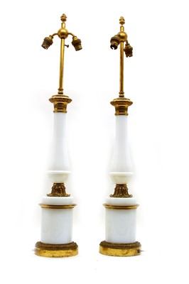 Lot 103 - A pair of opaline glass and gilt metal table lamps