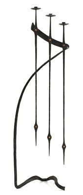 Lot 135 - A wrought iron three-branch standing candelabra