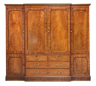 Lot 89 - A Regency mahogany, crossbanded and strung breakfront triple wardrobe