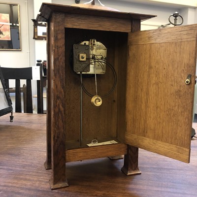 Lot 198 - A rare Arts and Crafts oak architectural clock, designed by CFA Voysey, c. 1902