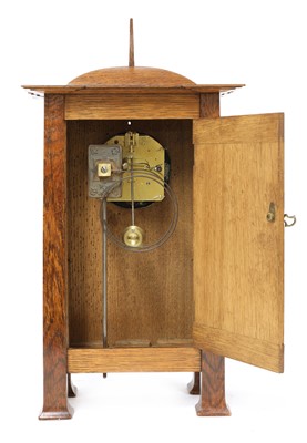 Lot 198 - A rare Arts and Crafts oak architectural clock, designed by CFA Voysey, c. 1902