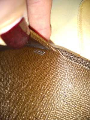 Lot 142 - A Louis Vuitton brown taiga leather desk agenda cover