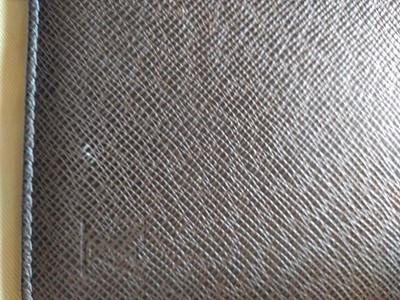 Lot 142 - A Louis Vuitton brown taiga leather desk agenda cover