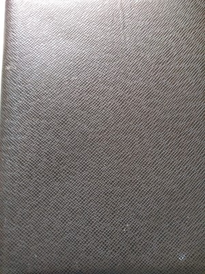 Lot 142 - A Louis Vuitton brown taiga leather desk agenda cover