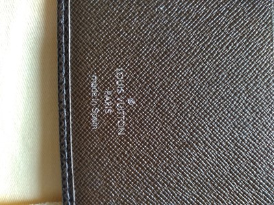 Lot 142 - A Louis Vuitton brown taiga leather desk agenda cover