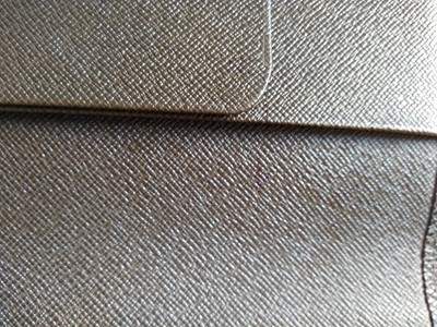 Lot 142 - A Louis Vuitton brown taiga leather desk agenda cover