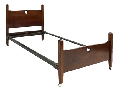 Lot 180 - An Arts and Crafts mahogany single bed