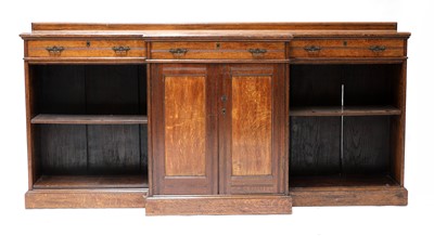 Lot 114 - A large late Victorian oak breakfront bookcase