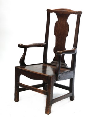 Lot 100 - A substantial oak country open armchair