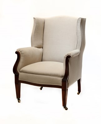 Lot 73 - A mahogany wingback armchair