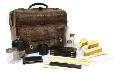 Lot 148 - A crocodile skin travelling vanity case