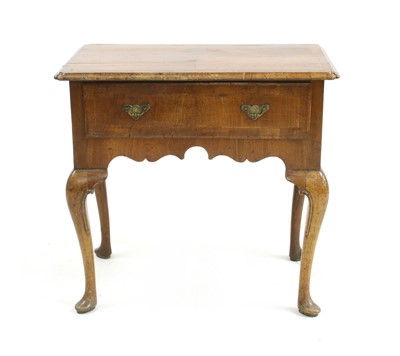 Lot 482 - An early 18th century walnut lowboy