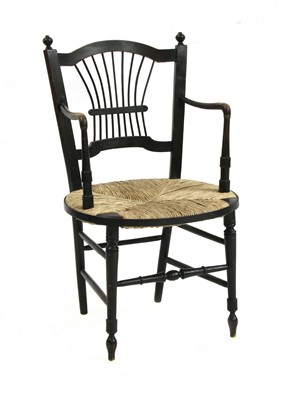 Lot 72 - A Morris & Co. ebonised elbow chair