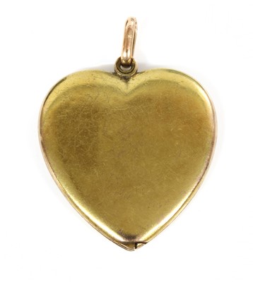 Lot 85 - A gold heart-shaped swivel locket, c.1910