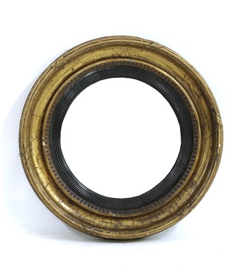 Lot 303 - A circular gilt wall mirror with convex glass