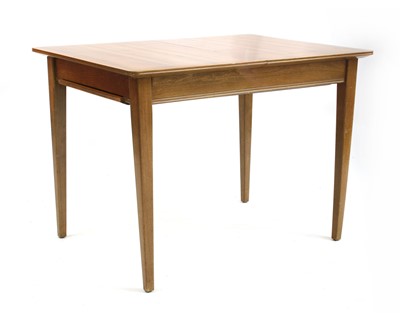 Lot 407 - A Gordon Russell walnut dining table